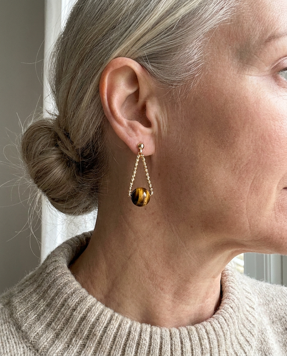 Customer wearing Aurelia Tiger's Eye earrings — bathroom mirror selfie